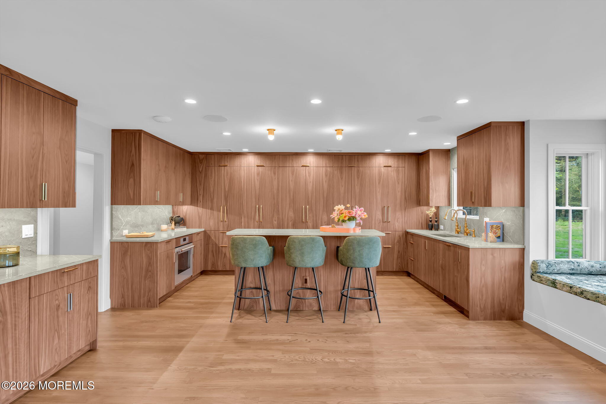 181 Rumson Road Rumson, NJ 07760 - Photo 14 of 79 a kitchen with a dining table chairs and white cabinets