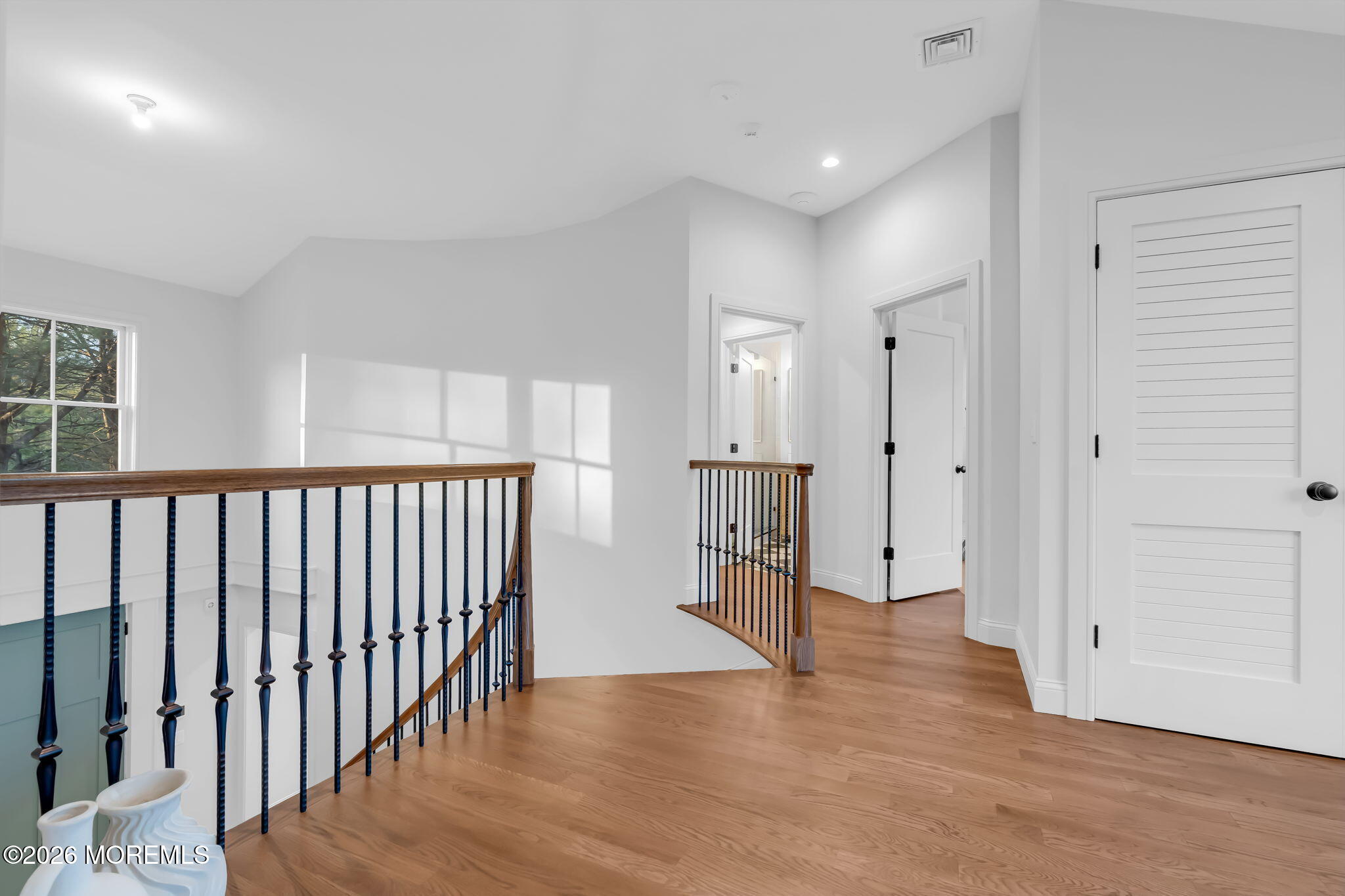 181 Rumson Road Rumson, NJ 07760 - Photo 30 of 79 a view of a hallway with wooden floor and windows