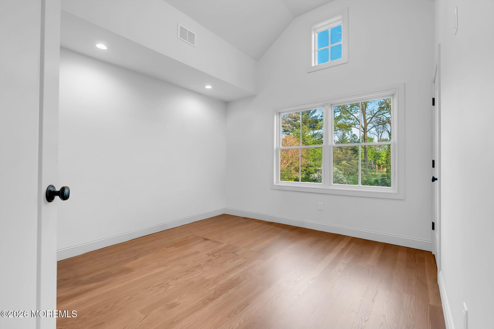 181 Rumson Road Rumson, NJ 07760 - Photo 42 of 79 an empty room with wooden floor and windows