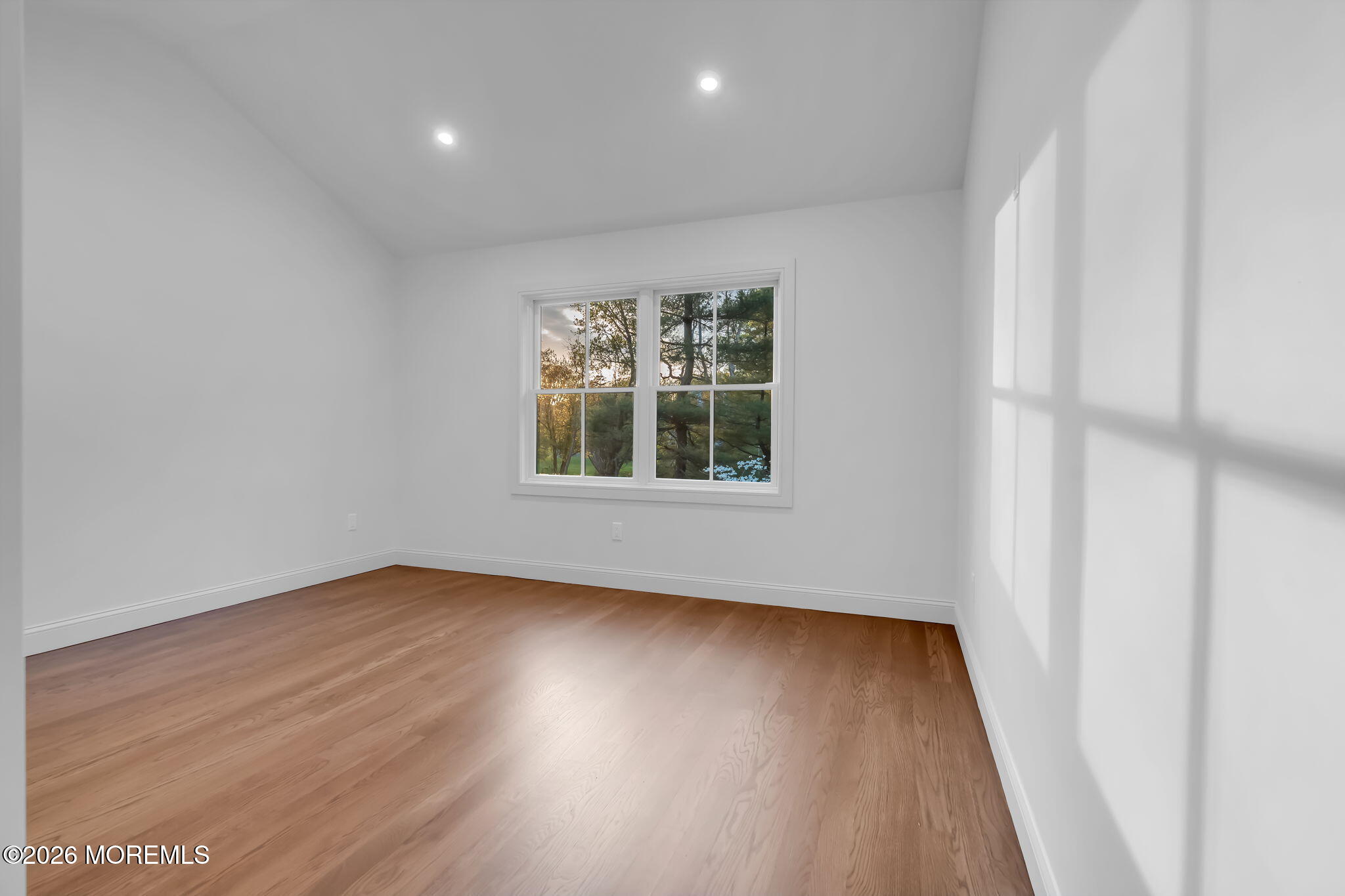 181 Rumson Road Rumson, NJ 07760 - Photo 46 of 79 an empty room with wooden floor and windows