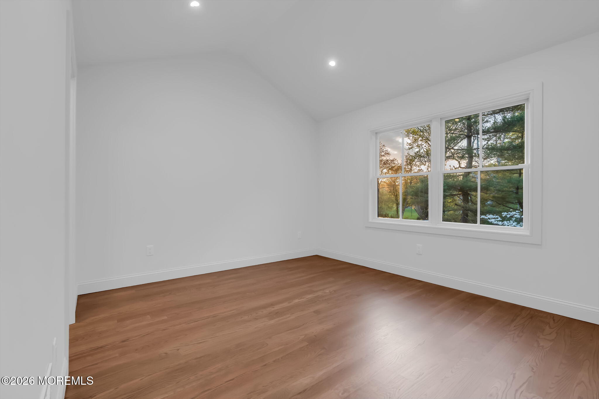 181 Rumson Road Rumson, NJ 07760 - Photo 47 of 79 an empty room with wooden floor and windows