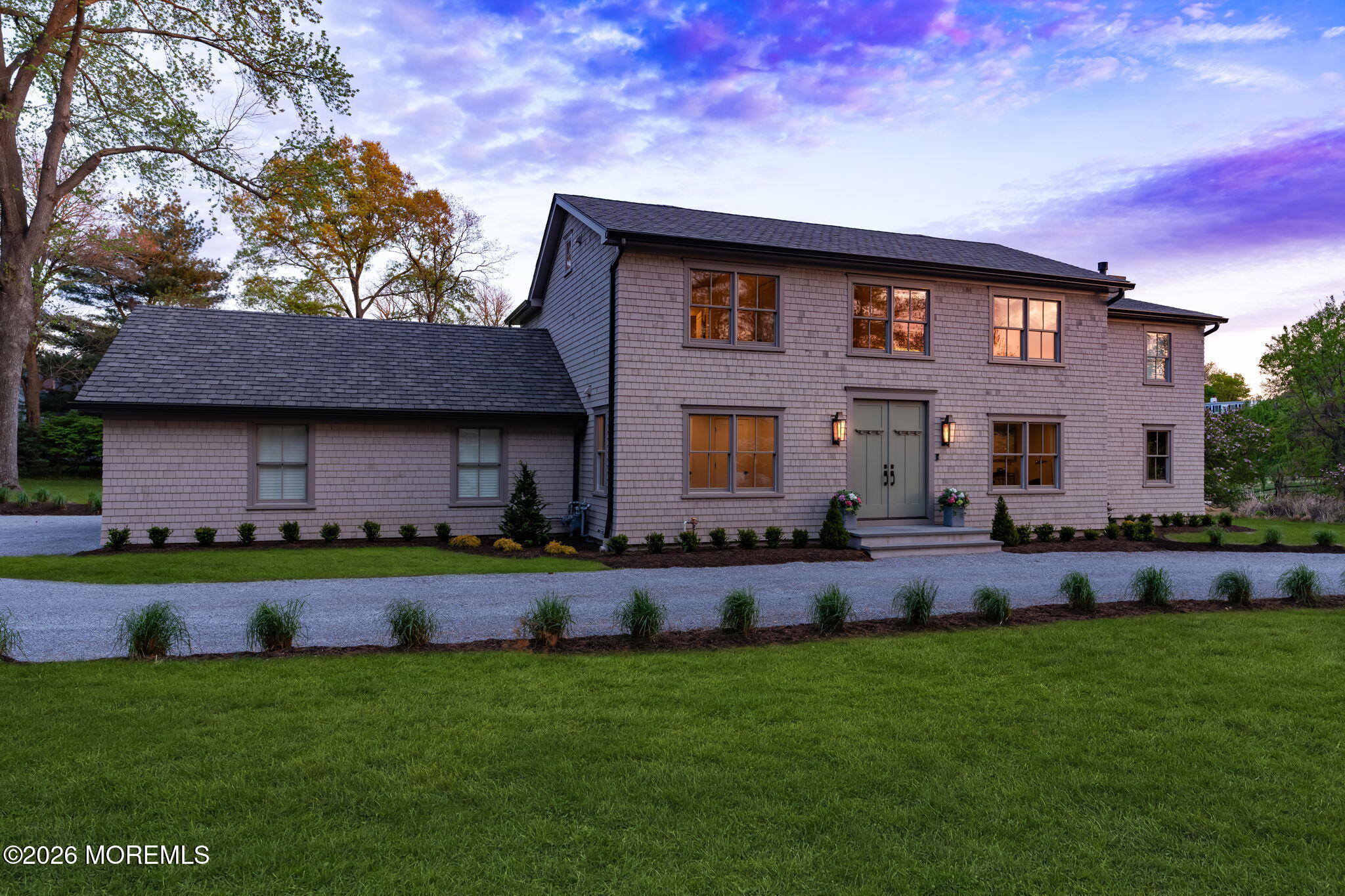 181 Rumson Road Rumson, NJ 07760 - Photo 5 of 79 a front view of a house with a yard and garage