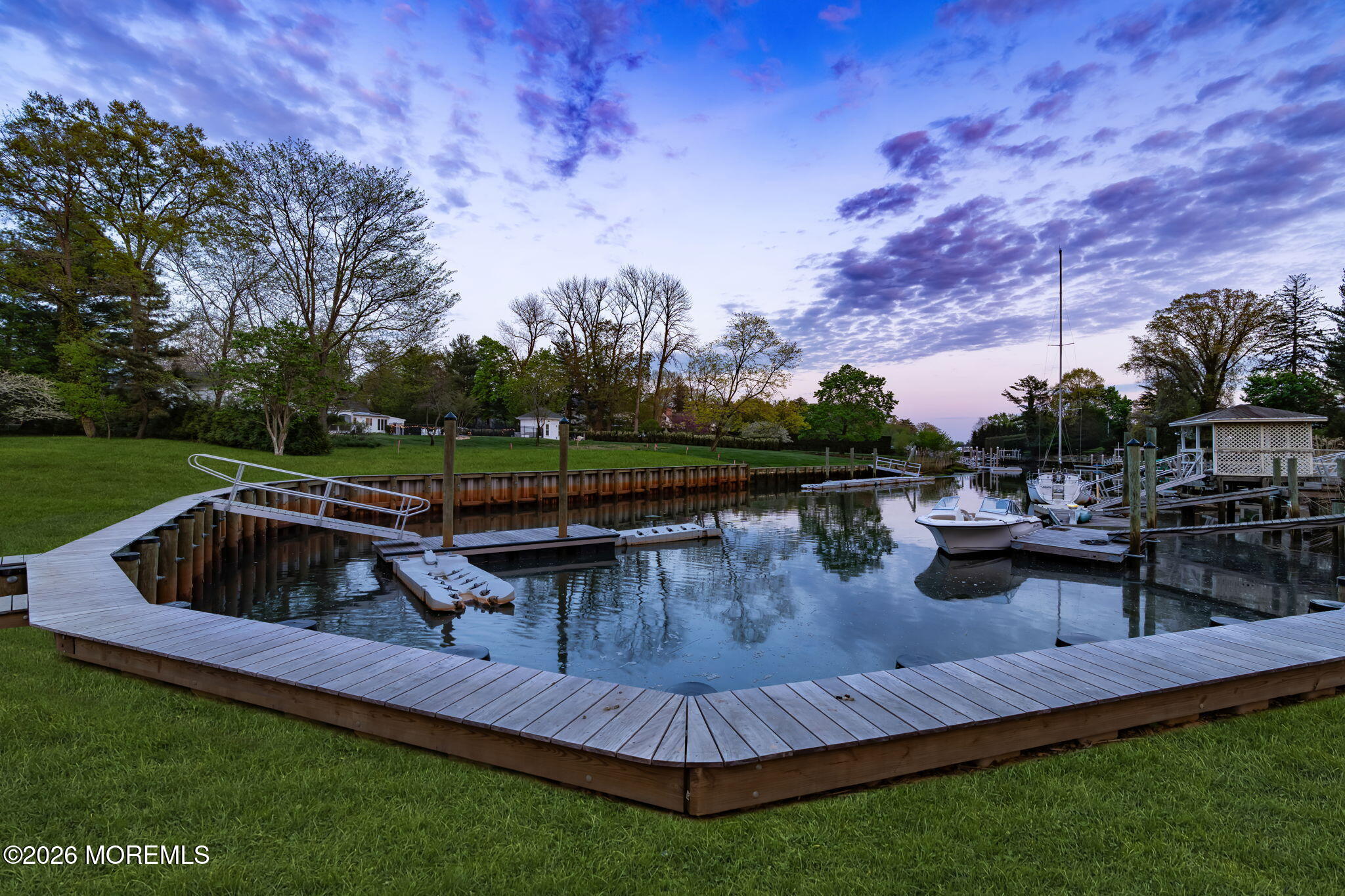181 Rumson Road Rumson, NJ 07760 - Photo 59 of 79 a view of a swimming pool with a table and chairs