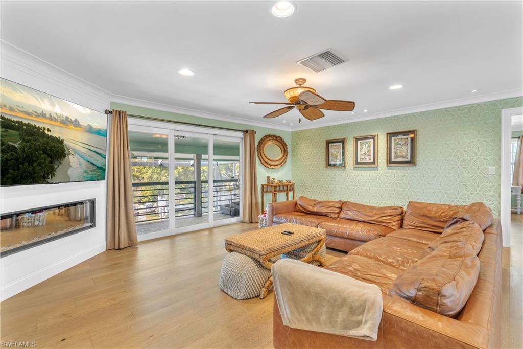 3001 50th Street Southwest Naples, FL 34116 - Photo 24 of 46 a living room with furniture and a flat screen tv