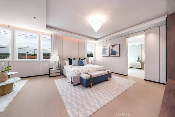 a spacious bedroom with a large bed and a couch