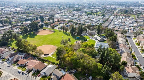 an aerial view of residential houses with outdoor space