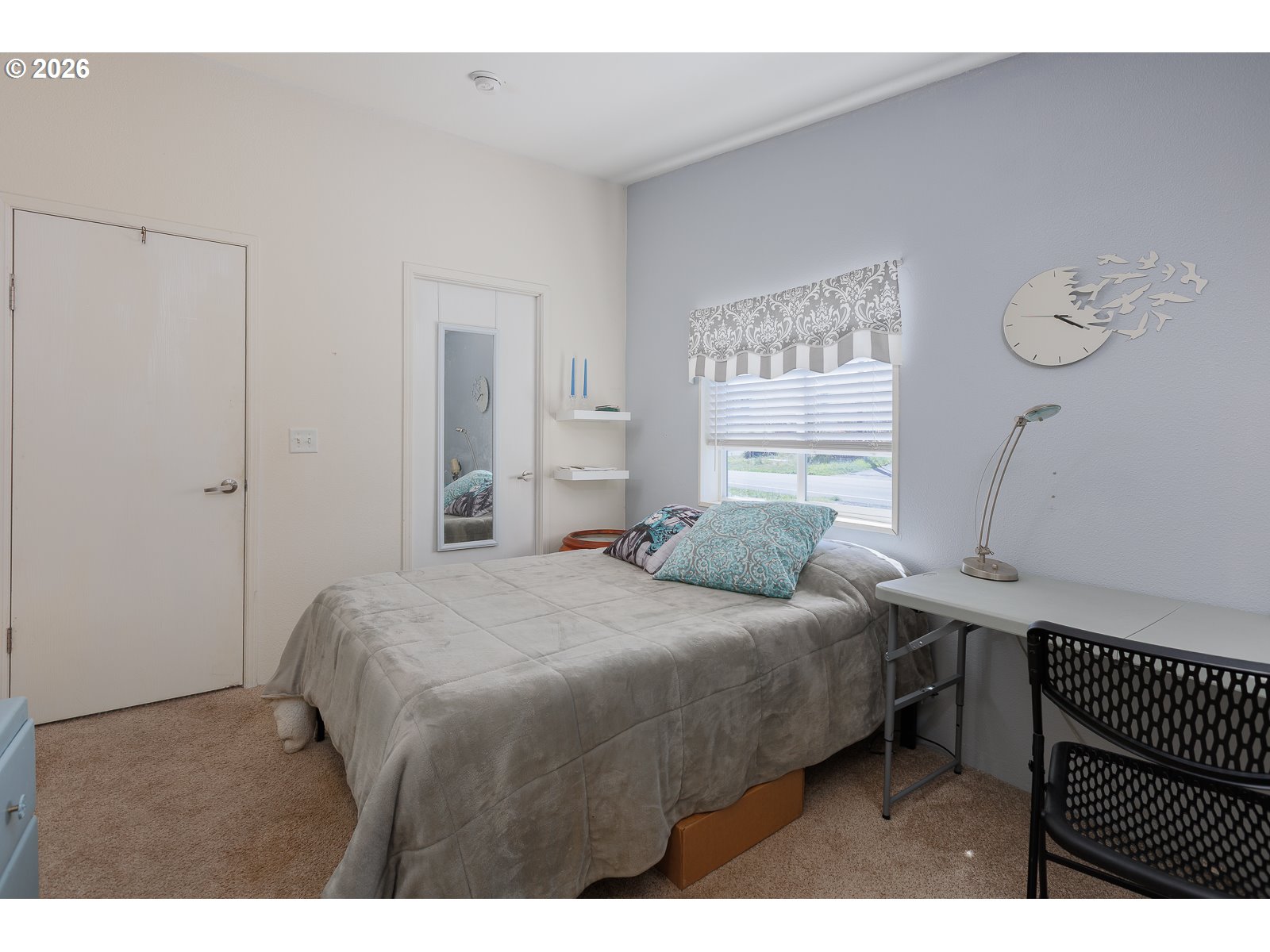 2018 Northwest Oceanic Loop Waldport, OR 97394 - Photo 21 of 35 a bedroom with a bed and a window