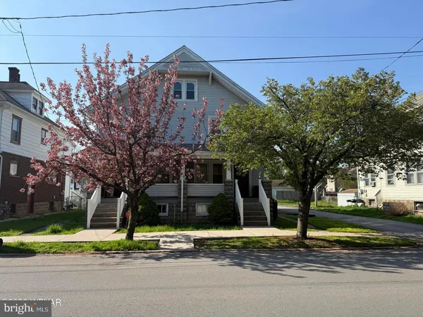 a view of a house with a street