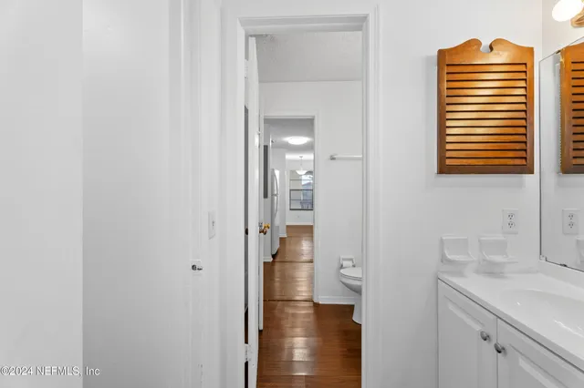 a bathroom with a sink a mirror and shower