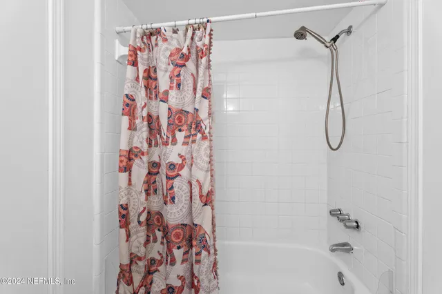 a bathroom with a shower curtain