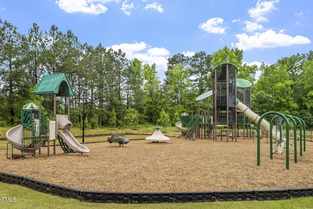 a view of a park with large trees