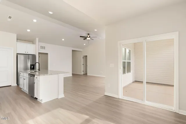 a view of kitchen with stainless steel appliances refrigerator oven and stove
