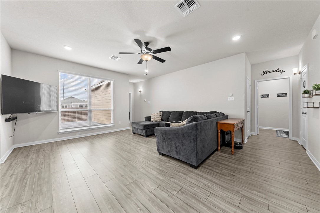 1906 Longmire Loop Temple, TX 76502 - Photo 13 of 32 a living room with furniture and a flat screen tv