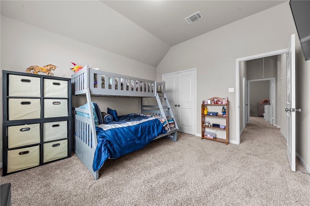 1906 Longmire Loop Temple, TX 76502 - Photo 21 of 32 a bedroom with a bed and a closet