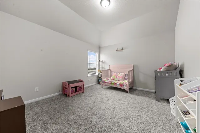 a room with furniture and a flat screen tv