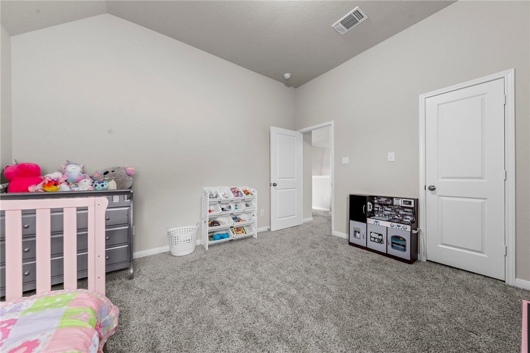1906 Longmire Loop Temple, TX 76502 - Photo 23 of 32 a bedroom with furniture and a window