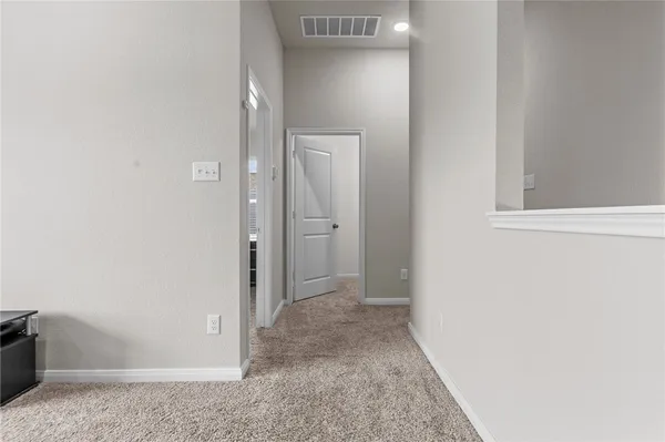 a bathroom with a granite countertop bathtub sink vanity mirror and toilet