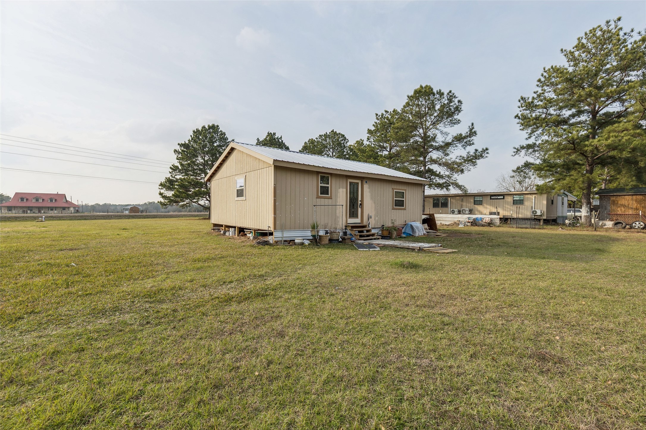 25 Pine Prairie School Road Huntsville, TX 77320 - Photo 1 of 15 a view of a patio with a yard