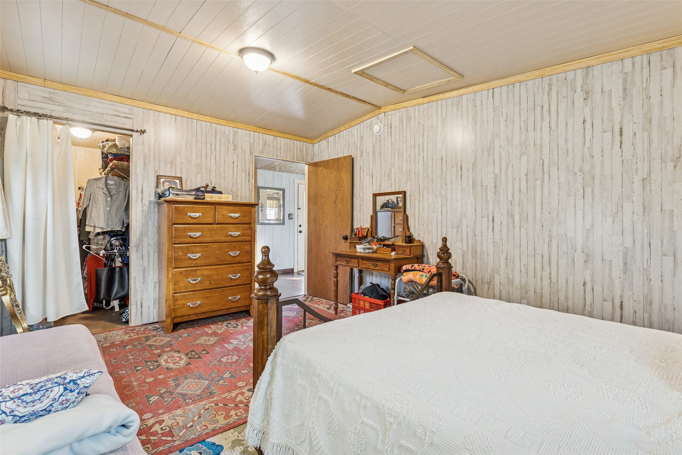 25 Pine Prairie School Road Huntsville, TX 77320 - Photo 11 of 15 a bedroom with bed and a closet