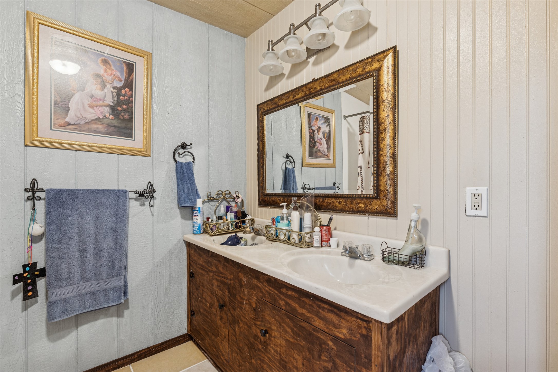 25 Pine Prairie School Road Huntsville, TX 77320 - Photo 13 of 15 a bathroom with a sink vanity and a mirror