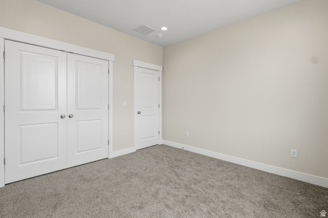 169 West 100 South Joseph, UT 84739 - Photo 22 of 35 Unfurnished bedroom with carpet floors, a closet, and recessed lighting