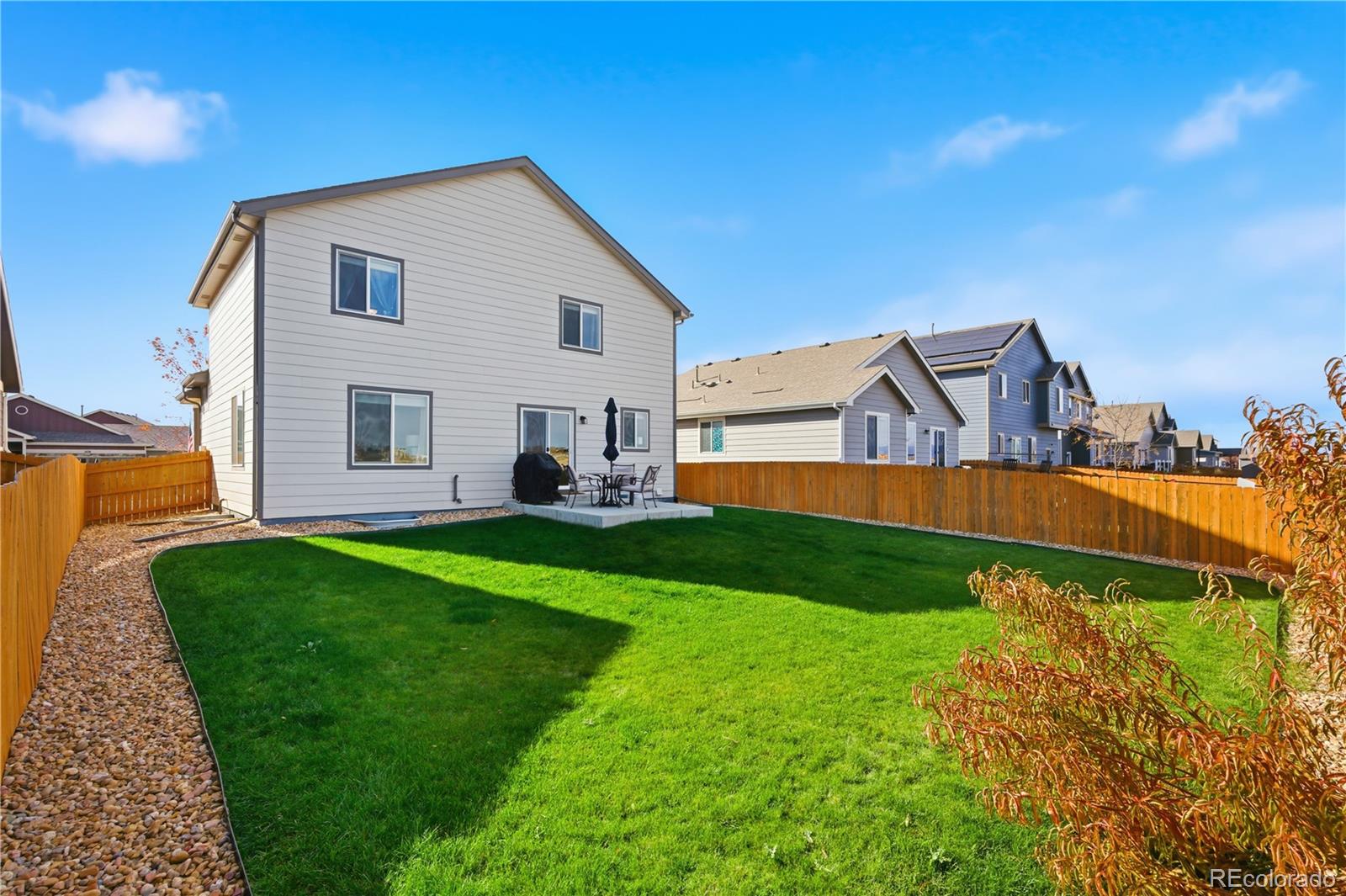2173 Angus Street Mead, CO 80542 - Photo 21 of 28 a view of a house with backyard