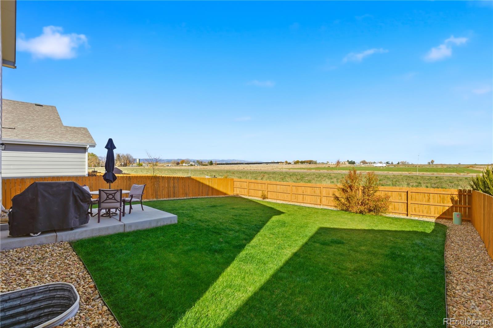 2173 Angus Street Mead, CO 80542 - Photo 22 of 28 a view of a garden and lake