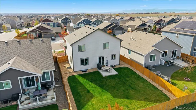 an aerial view of a house with deck yard and couches
