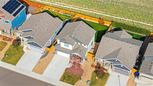 an aerial view of a house with a ocean view