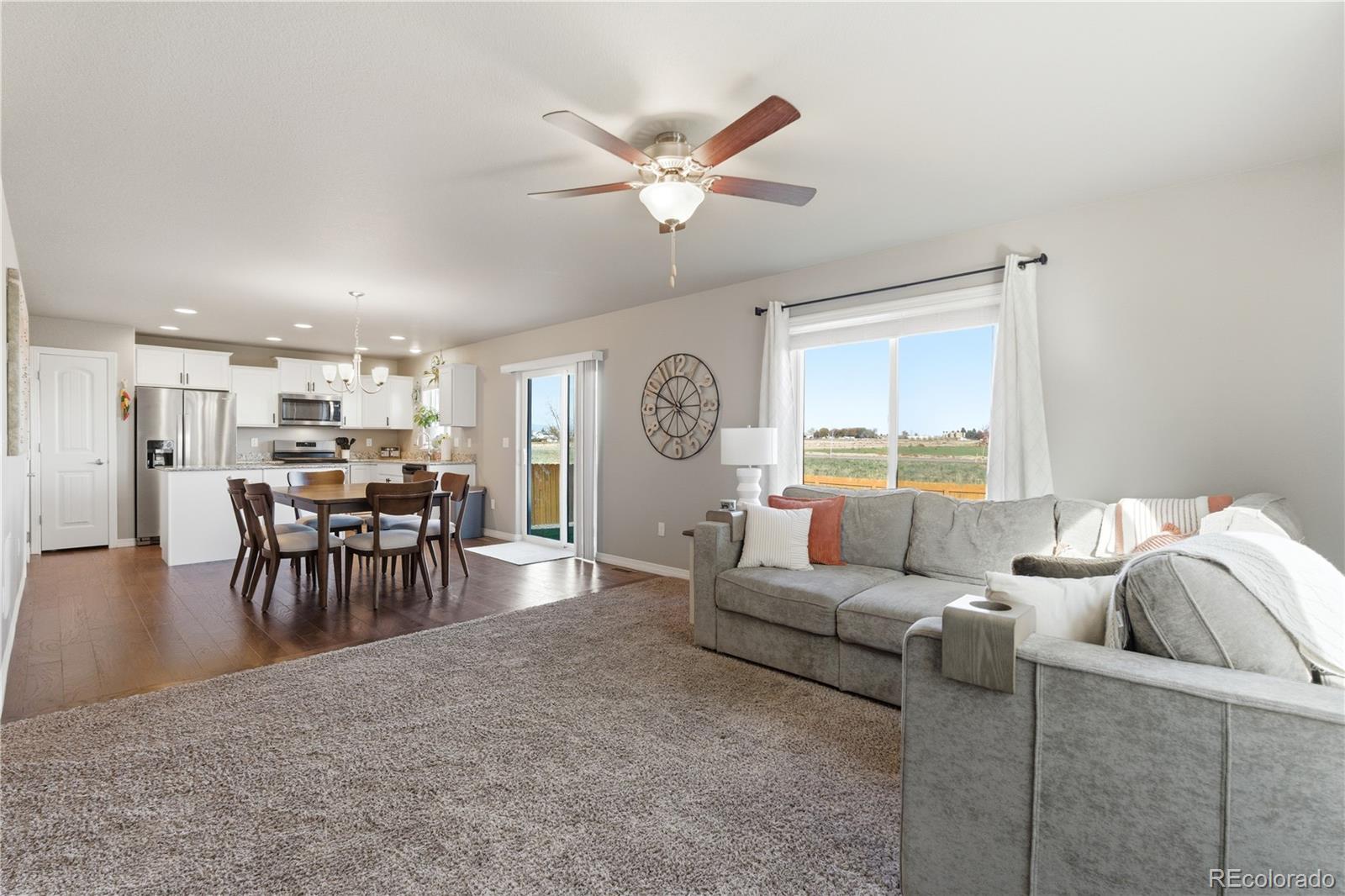 2173 Angus Street Mead, CO 80542 - Photo 6 of 28 a living room with furniture and a large window
