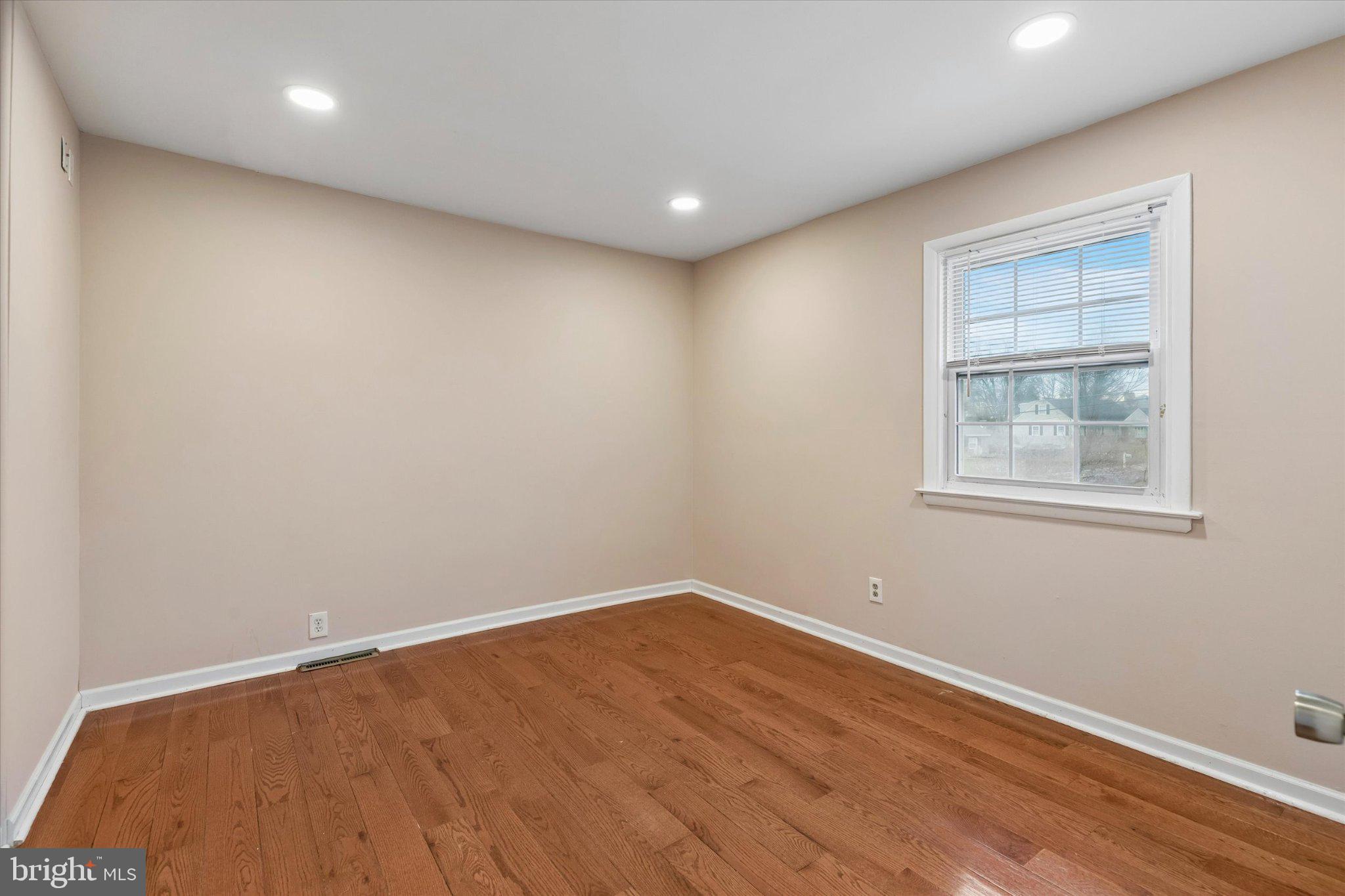 4150 Orangemans Road Hatboro, PA 19040 - Photo 13 of 25 a view of empty room with wooden floor and fan