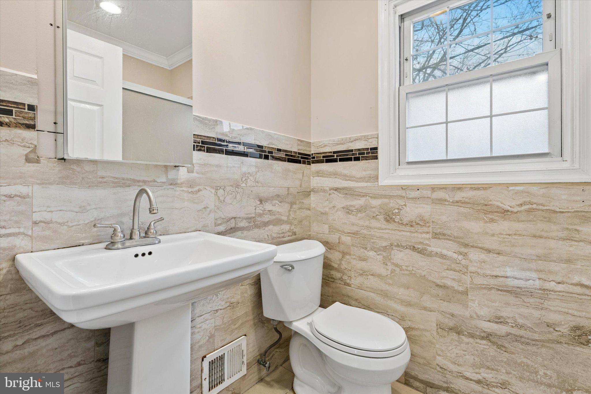 4150 Orangemans Road Hatboro, PA 19040 - Photo 20 of 25 a bathroom with a sink a toilet and mirror