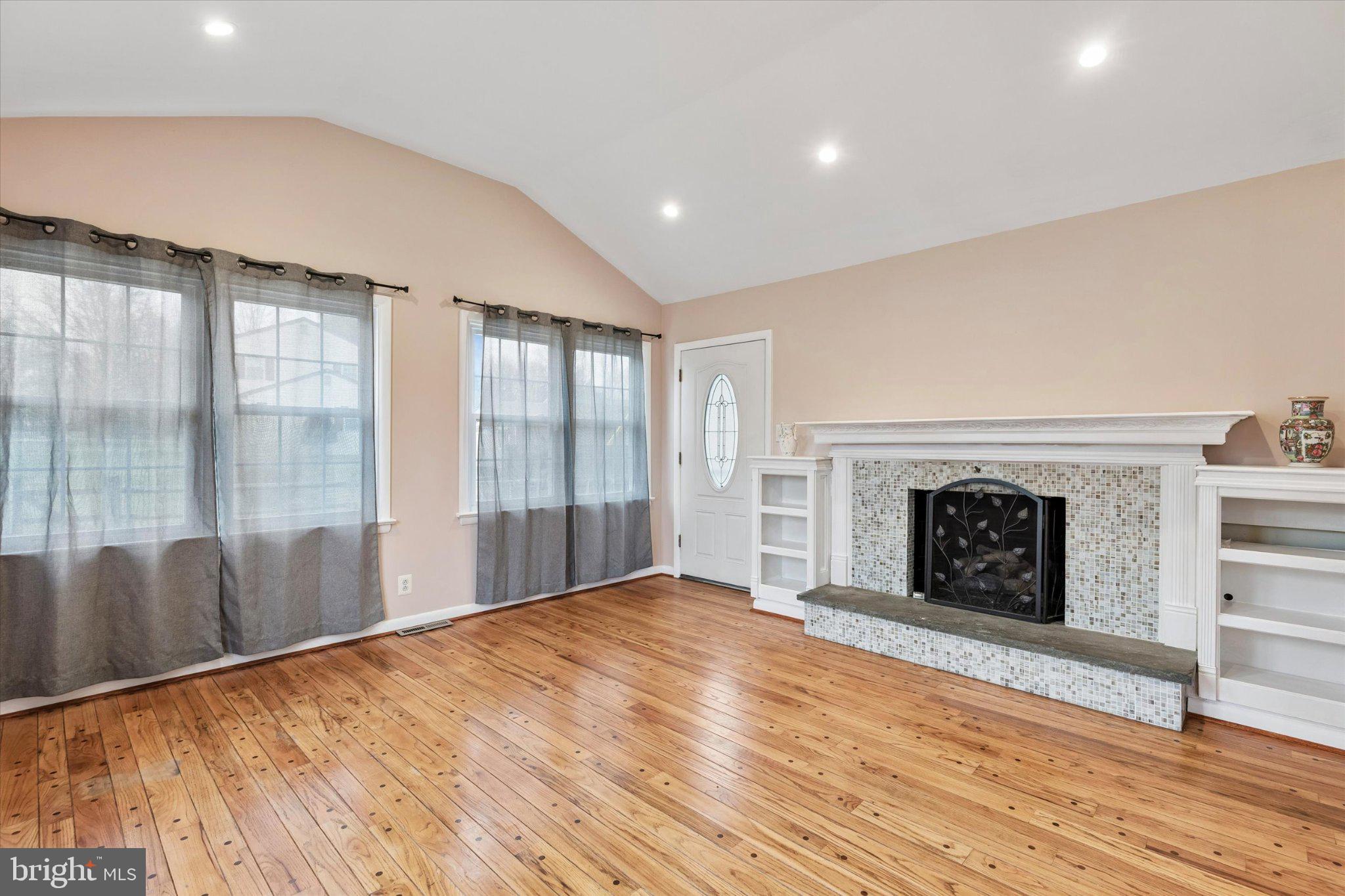 4150 Orangemans Road Hatboro, PA 19040 - Photo 8 of 25 a view of an empty room with a fireplace and a window