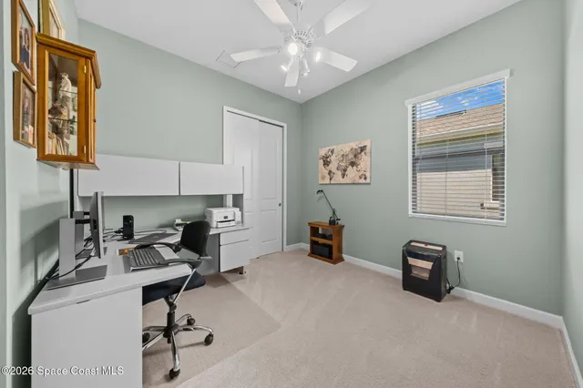 a view of a garage with rack and bicycle