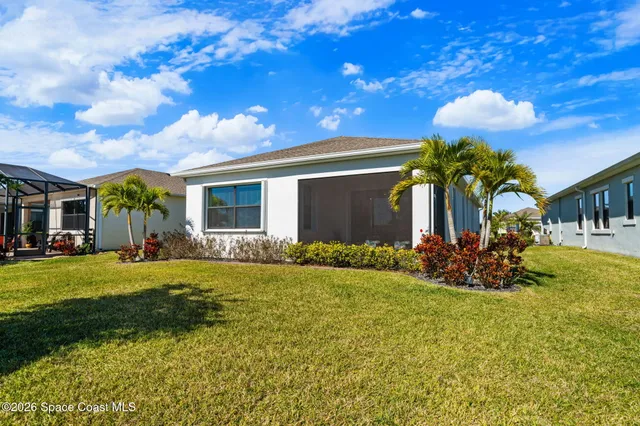 a aerial view of a house with a swimming pool