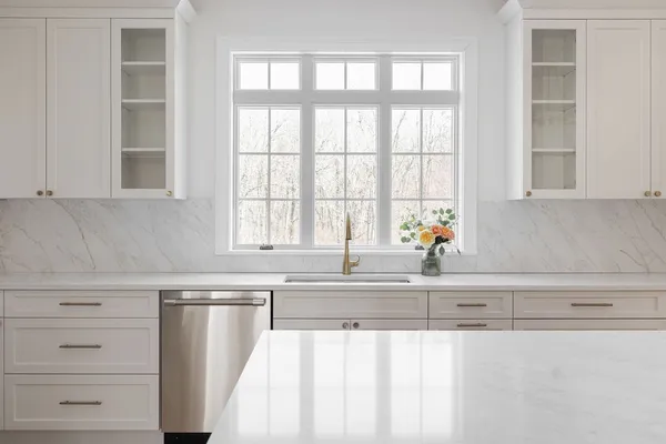 a view of a livingroom with an empty space and a fireplace