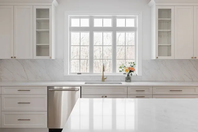 a view of a livingroom with an empty space and a fireplace