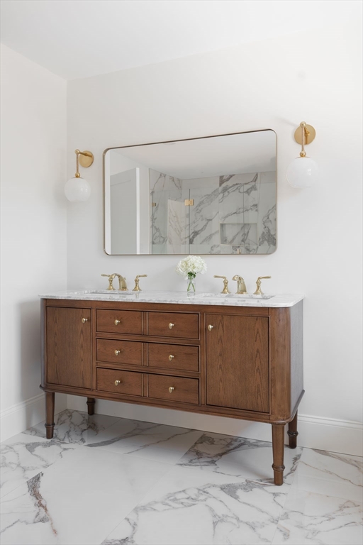 41 Winter Street Reading, MA 01867 - Photo 11 of 20 a bathroom with a sink and mirror
