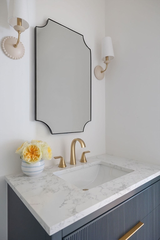 41 Winter Street Reading, MA 01867 - Photo 19 of 20 a bathroom with a sink and a mirror