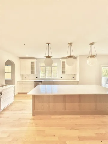 a kitchen with a stove and a cabinet