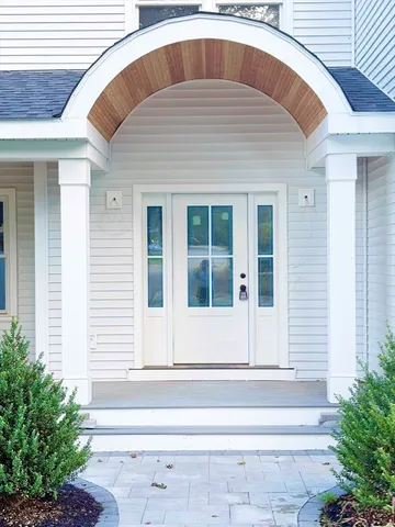 a view of staircase with railing and a floor to ceiling window