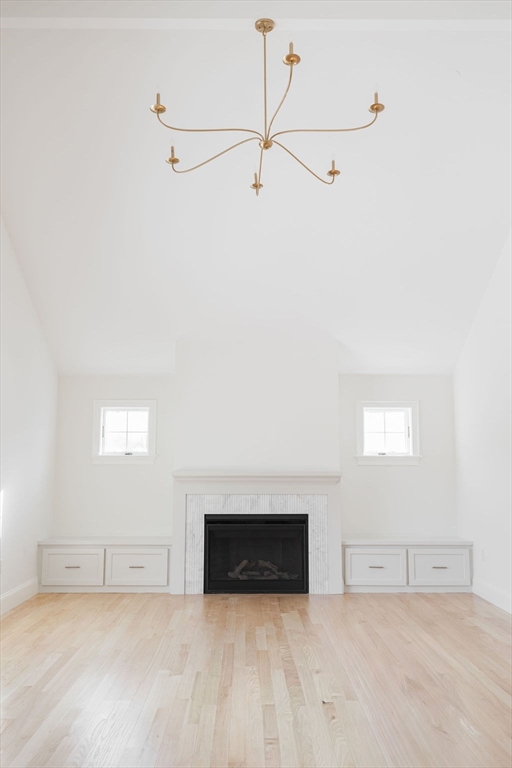 41 Winter Street Reading, MA 01867 - Photo 6 of 20 a view of a livingroom with an empty space and a fireplace
