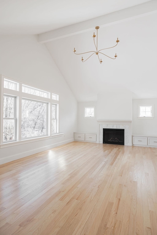 41 Winter Street Reading, MA 01867 - Photo 9 of 20 an empty room with wooden floor and windows