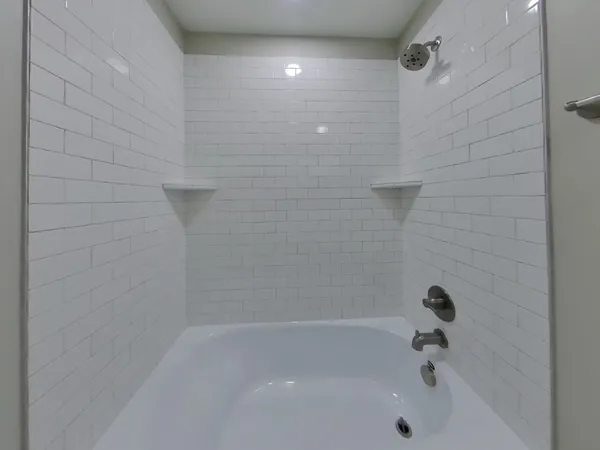 a bathroom with a shower and a bathtub