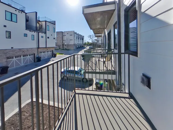 a view of balcony with wooden floor