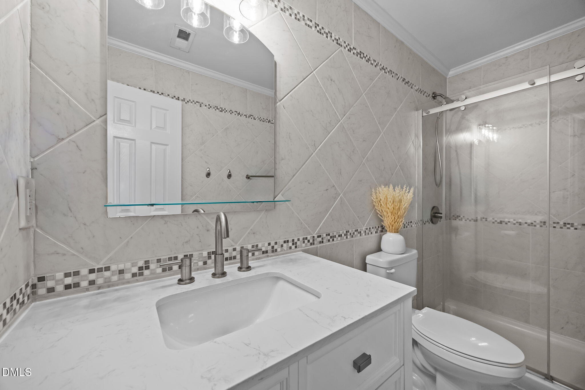 1316 South State Street, Unit D Raleigh, NC 27610 - Photo 12 of 36 a bathroom with a sink a toilet and shower