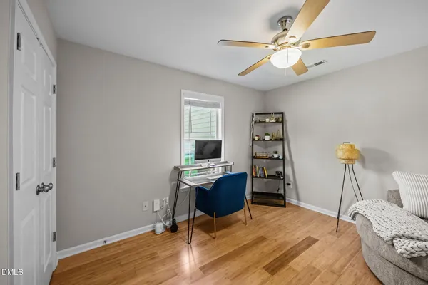 a workspace with furniture and wooden floor