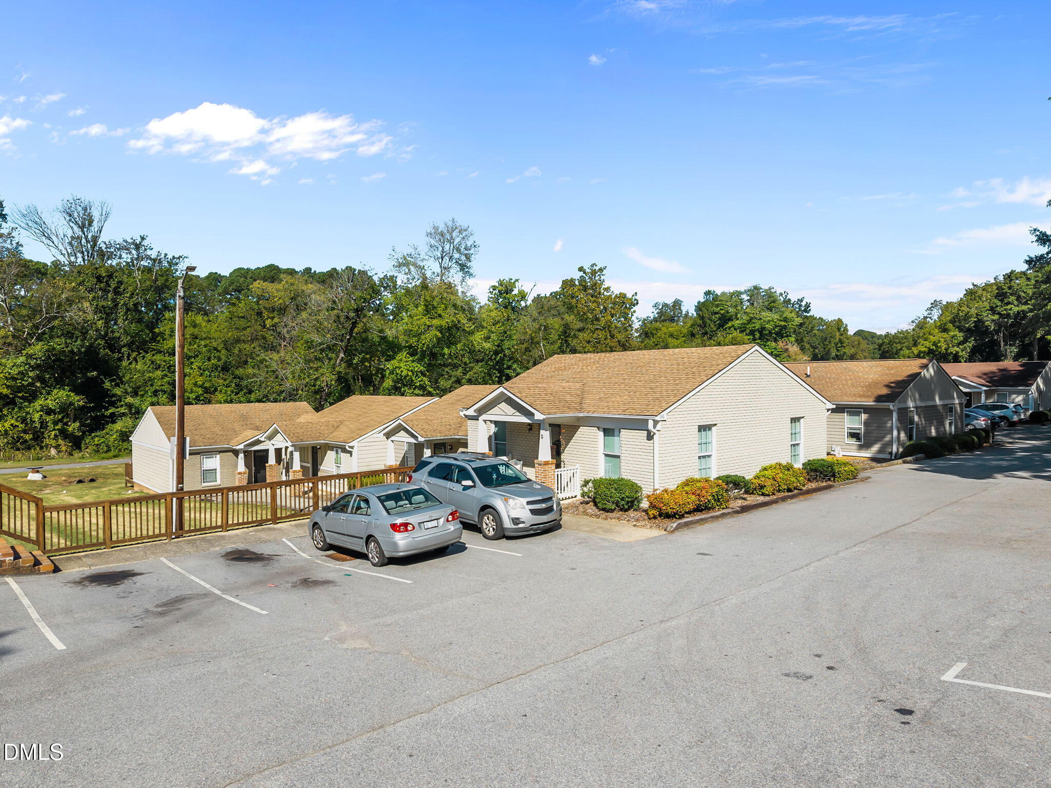 1316 South State Street, Unit D Raleigh, NC 27610 - Photo 31 of 36 a car parked in front of a house with a big yard