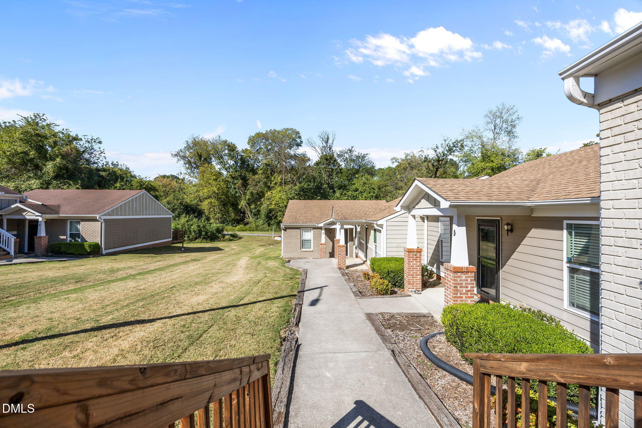 1316 South State Street, Unit D Raleigh, NC 27610 - Photo 32 of 36 a view of a house with a yard and potted plants