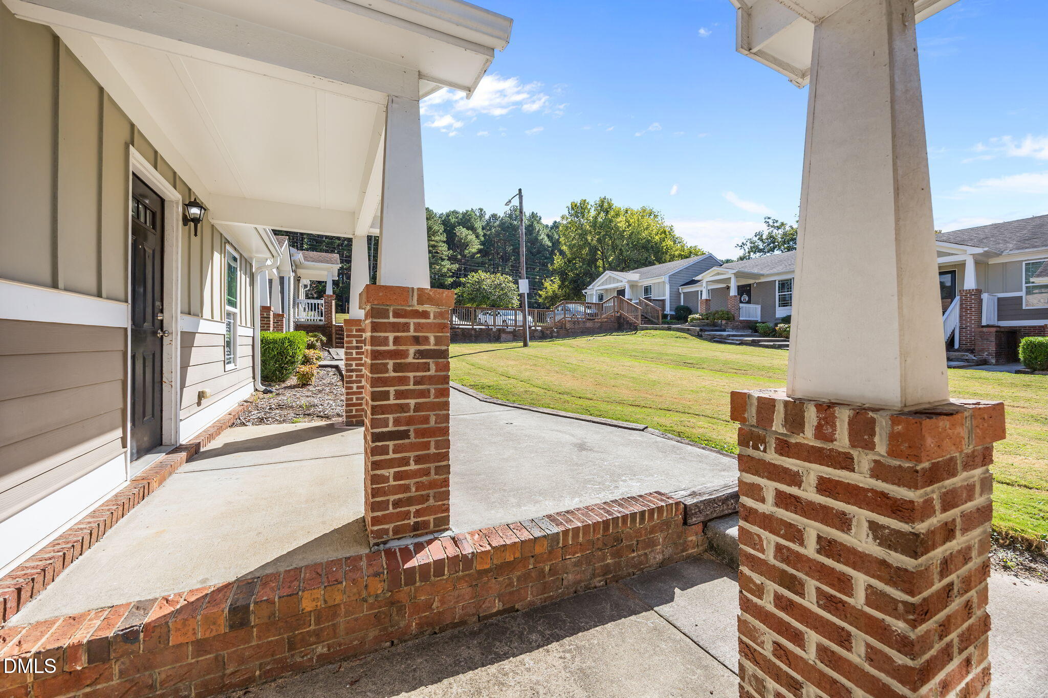 1316 South State Street, Unit D Raleigh, NC 27610 - Photo 33 of 36 a view of a patio with a table and chairs